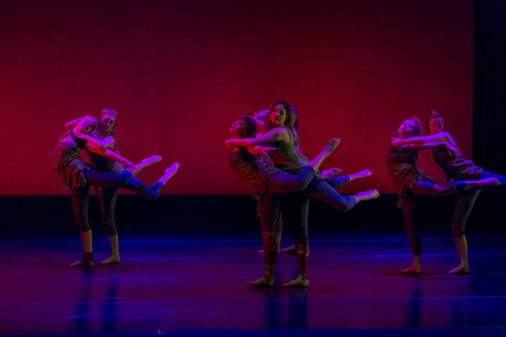 Dancers performing on stage in 2015 Spring Dance Concert Stitchworks